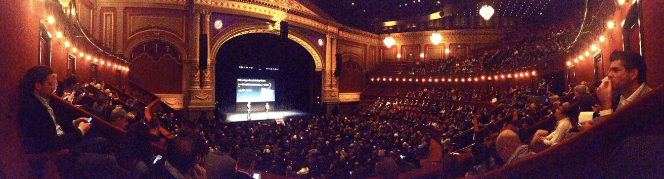 This is a photo of Peter on stage in Amsterdam – the audience members are joining his database by texting from their smartphones to receive a digital copy of his presentation.
